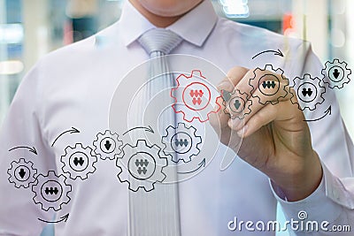 Businessman draws an important detail in the mechanism . Stock Photo