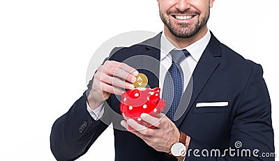 Businessman drop ethereum into piggy bank conceptual toothy smile isolated Editorial Stock Photo