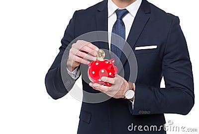 Businessman drop golden bitcoin into piggy bank isolated Stock Photo