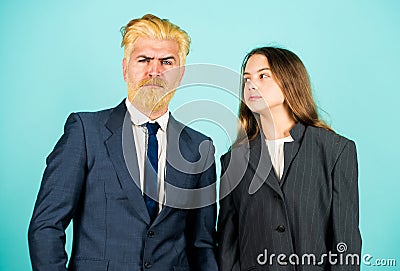 Businessman dyed blond hair. small girl in oversized jacket. choosing future career. family business startup. kid in Stock Photo