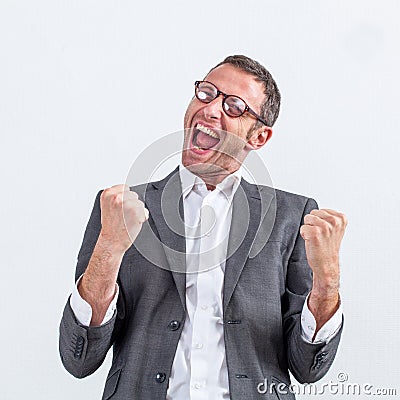 Businessman with dynamic body language screaming victory Stock Photo