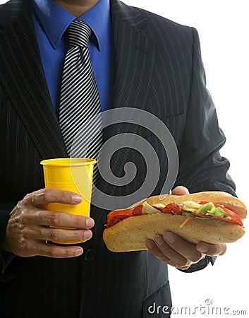 Businessman eating junk fast food Stock Photo