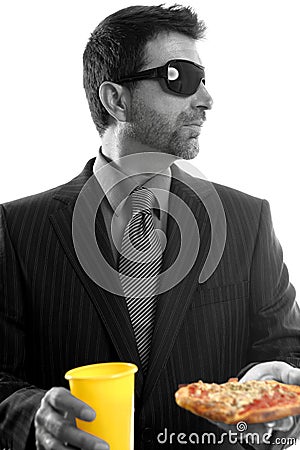 Businessman eating junk fast food Stock Photo