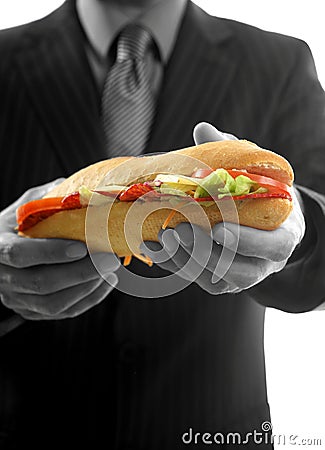 Businessman eating junk fast food Stock Photo