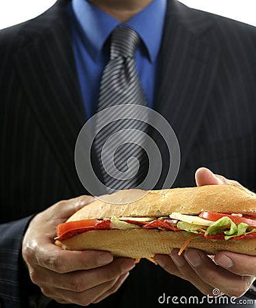 Businessman eating junk fast food Stock Photo