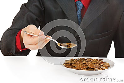 Businessman eating money Stock Photo