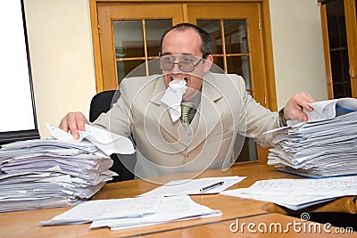 Businessman eating the work Stock Photo