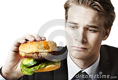 Businessman eating at work Stock Photo