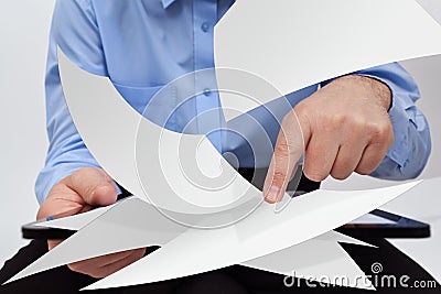 Businessman editing electronic documents concept Stock Photo