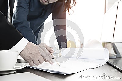 Businessman and engineer reviewing plan design Stock Photo