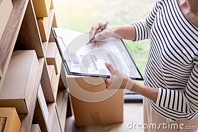 Businessman Shop owner check Order or list inventory in stock which is going to be delivery room. business online, e-commerce Stock Photo