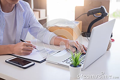 Businessman Shop owner check Order or list inventory in stock which is going to be delivery room. business online, e-commerce Stock Photo