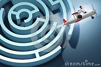 The businessman escaping from maze on airplane Stock Photo