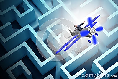 The businessman escaping from maze on airplane Stock Photo