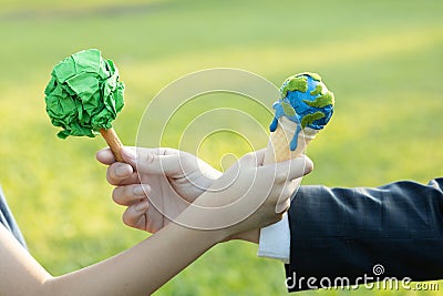 Businessman exchange tree to a boy holding melting Earth. Gyre Stock Photo