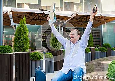 Businessman exploring the city guide Stock Photo