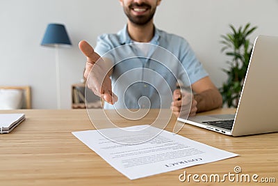Businessman extending hand for handshake, offer to sign contract Stock Photo
