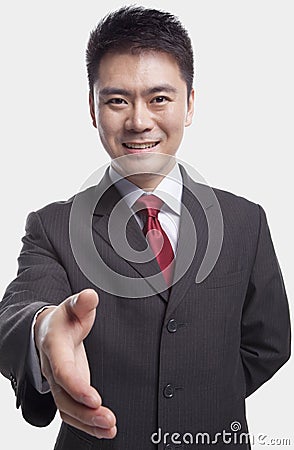 Businessman Extending His Hand Stock Photo