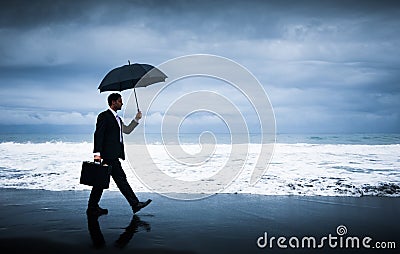 Businessman facing storm Stock Photo