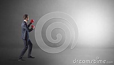 Businessman fighting in an empty space Stock Photo