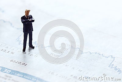 Businessman figure on a stock chart Stock Photo