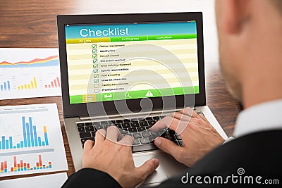 Businessman filling checklist form Stock Photo