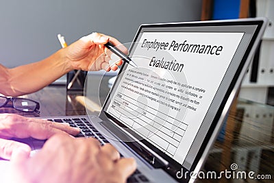 Businessman Filling Employee Performance Evaluation Form Stock Photo