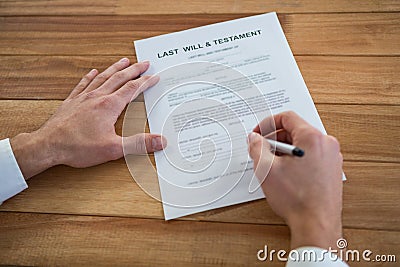 Businessman filling last will and testament form Stock Photo