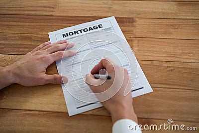 Businessman filling mortgage contract form Stock Photo