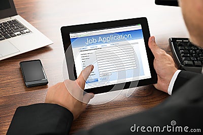 Businessman filling online job application Stock Photo