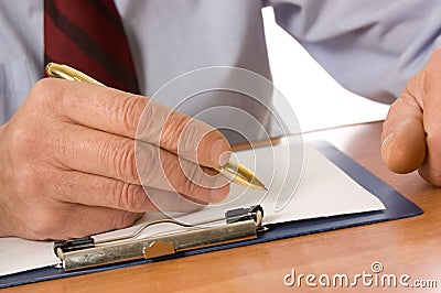 The businessman fills the document Stock Photo