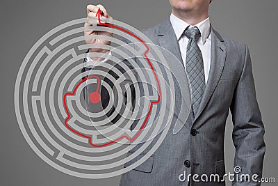 Businessman finding the solution of a maze Stock Photo