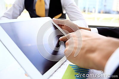 Businessman finger pointing to the screen of tablet-pc Stock Photo