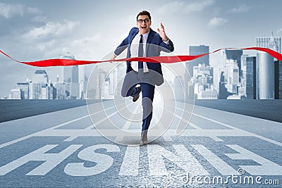 The businessman on the finishing line in competition concept Stock Photo