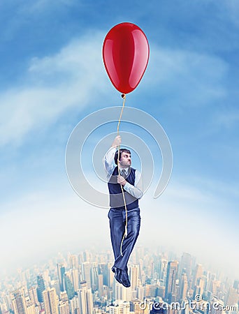 Businessman flying on the big ballon Stock Photo