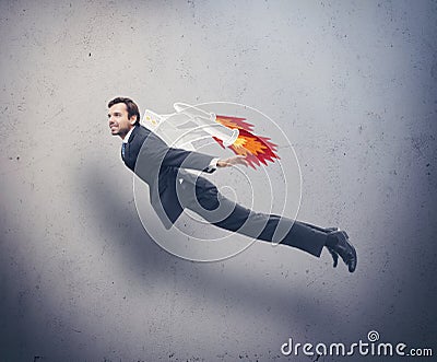 Businessman flying with rocket backpack Stock Photo