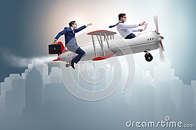 The businessman flying on vintage old airplane Stock Photo