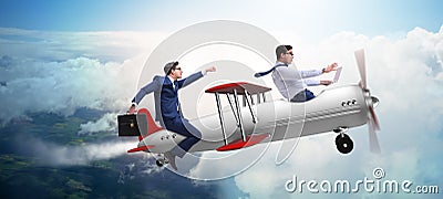 The businessman flying on vintage old airplane Stock Photo