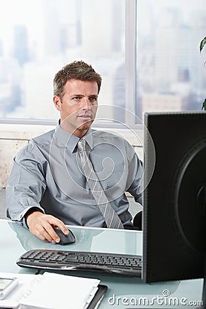 Businessman focusing on work Stock Photo