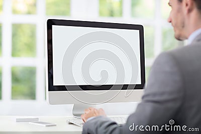 Businessman front of desktop Stock Photo