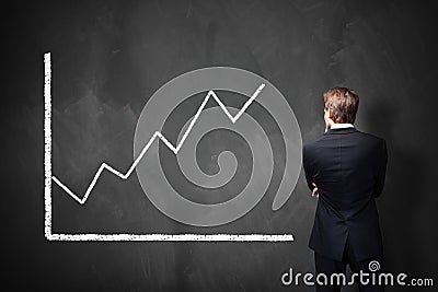 Businessman in front of a diagram Stock Photo