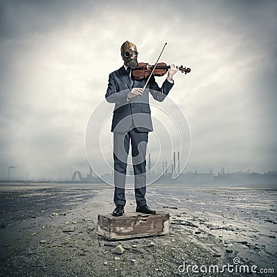 Businessman with gas mask, plays the violin Stock Photo