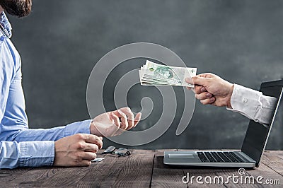 Businessman gets polish cash from the hand Stock Photo