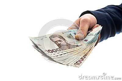 Businessman gives bribe or pay, in isolation. UAH. 1000 new banknote Ukrainian money Stock Photo