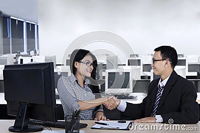 Businessman giving congrats to a new employee Stock Photo