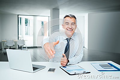 Businessman giving an handshake Stock Photo