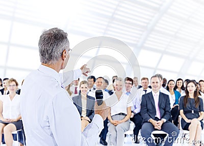 Businessman giving presentation to his Colleagues Stock Photo