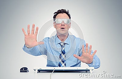 Businessman with glasses of foil in front of computer. Stock Photo