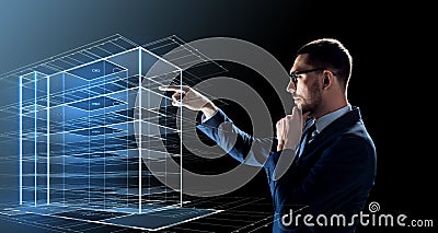 Businessman in glasses with virtual building Stock Photo