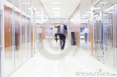 Businessman goes along a corridor Stock Photo